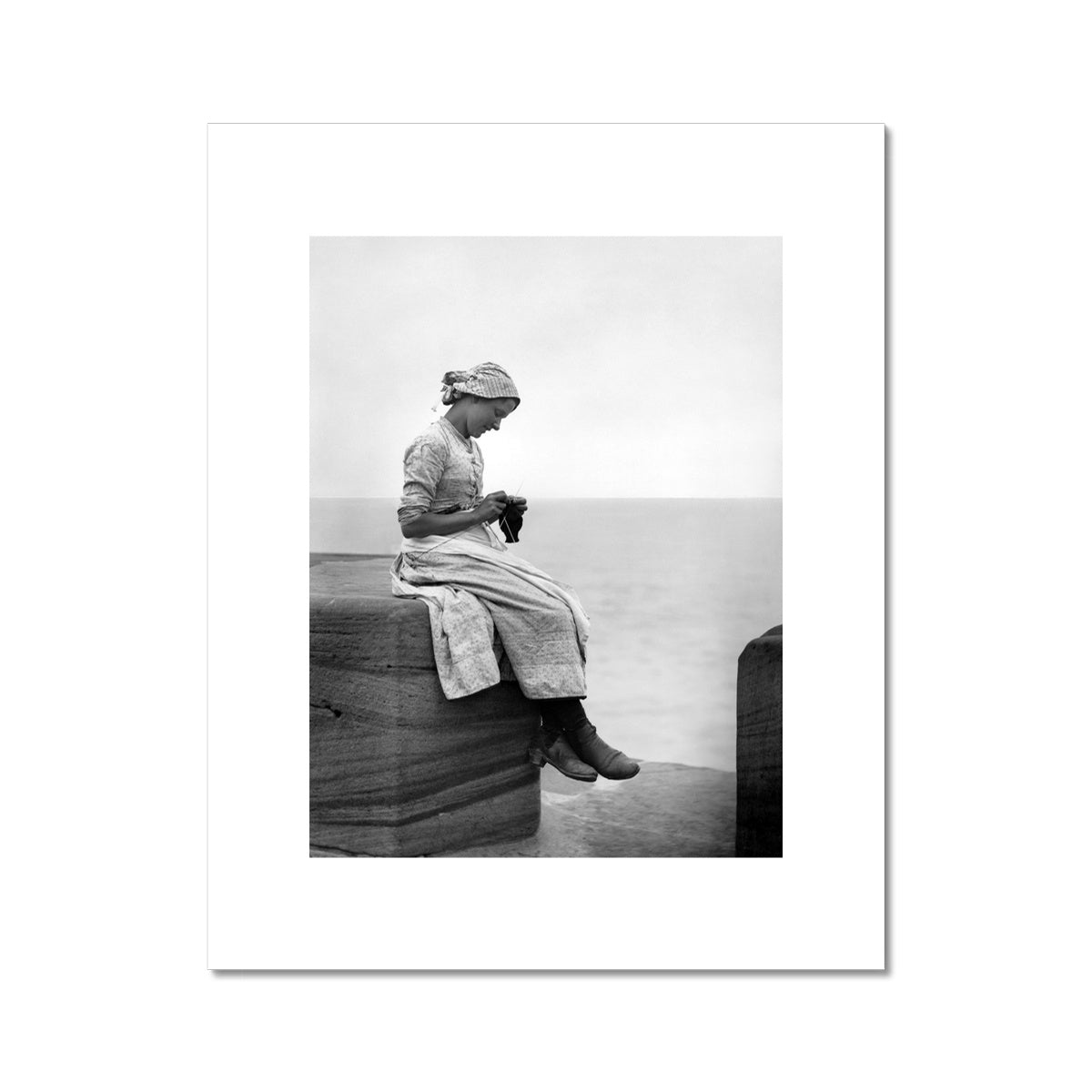 Girl knitting on West Pier C-Type Print